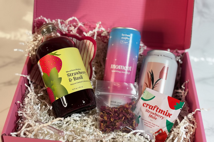 Alcohol and related products in a box with a checkered pattern on the lid.