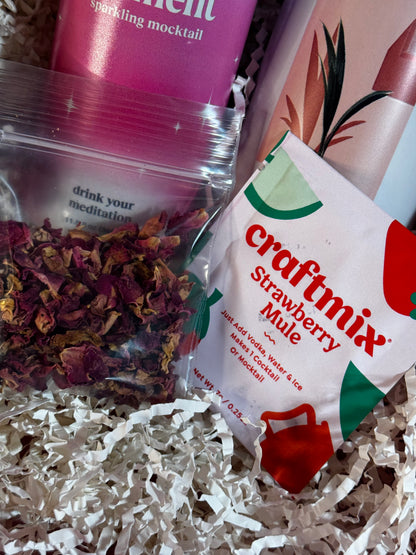Craftmix Strawberry Mule mix packet and dried herbs on a textured surface